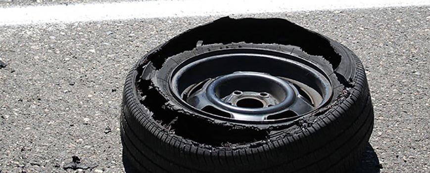 Torn tyre on the side of the road