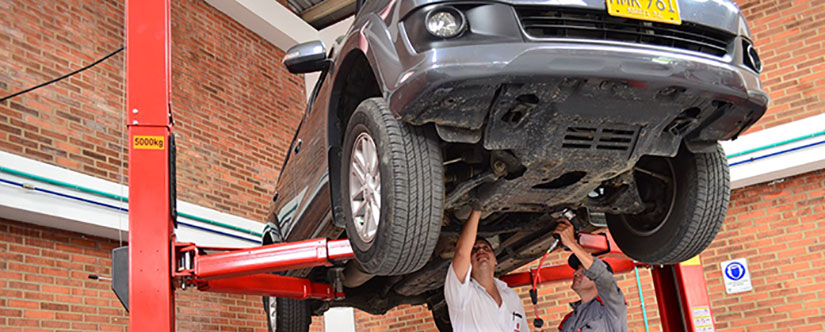 Car in garage on two post lift